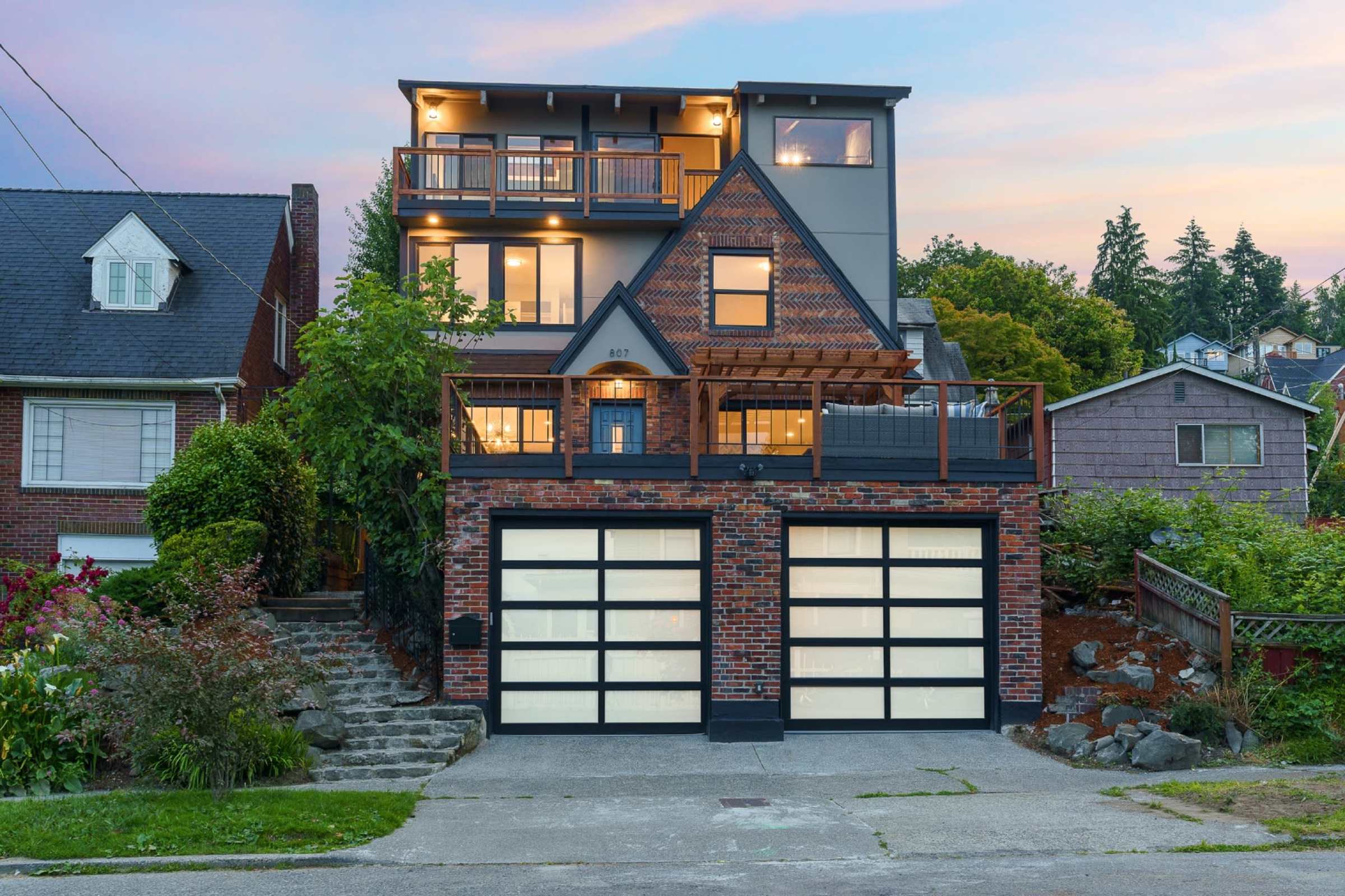 A JH1 Homes renovation at dusk in West Seattle